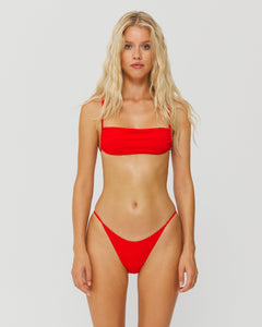 model wearing red bikini 
