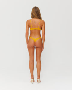 model wearing yellow bikini
